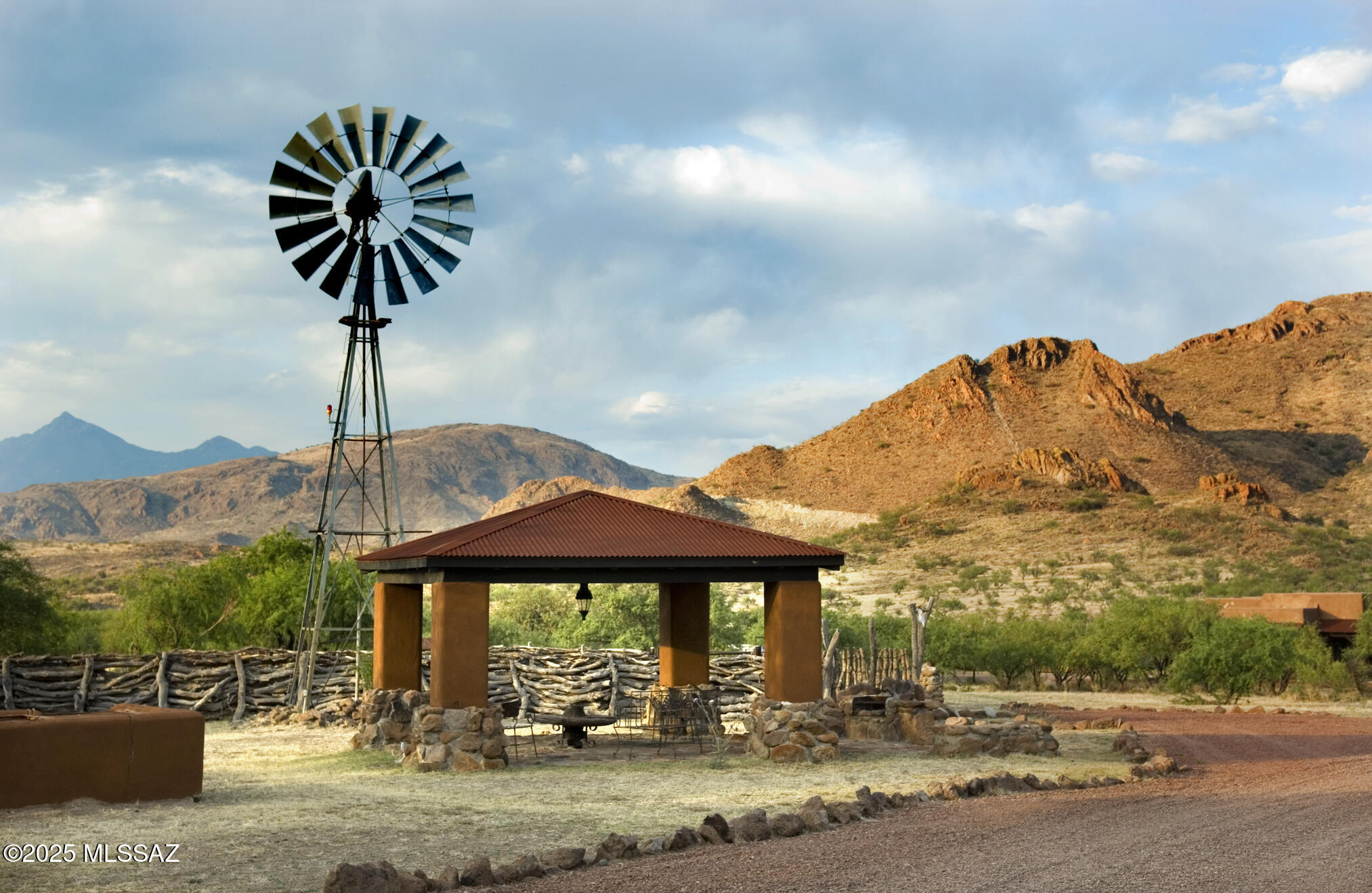 1265 Morning Star Drive Rio Rico, AZ 85648 - Photo 42 of 50 a front view of a building with garden