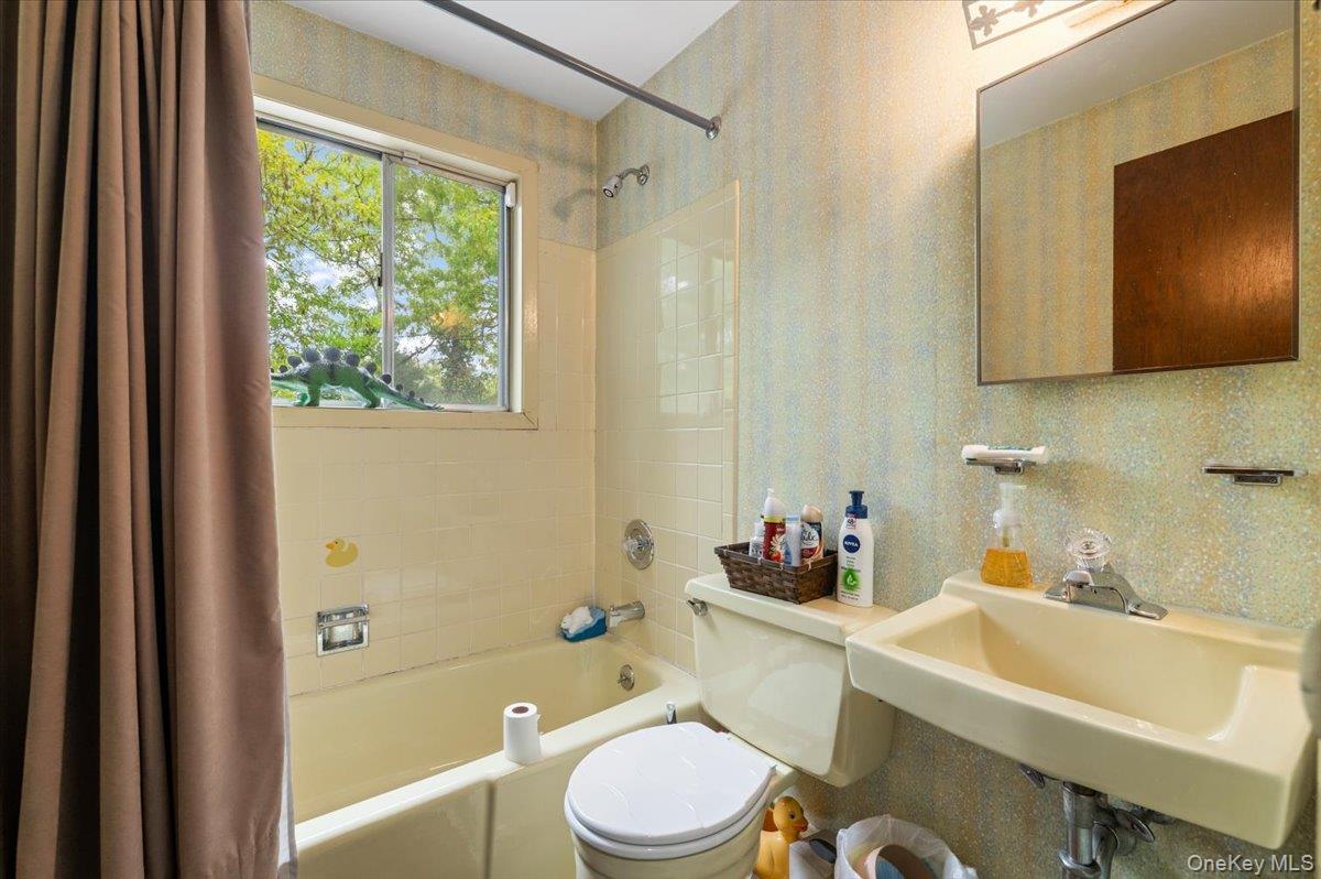 6 Apex Road Melville, NY 11747 - Photo 28 of 50 a bathroom with a sink toilet tub and shower