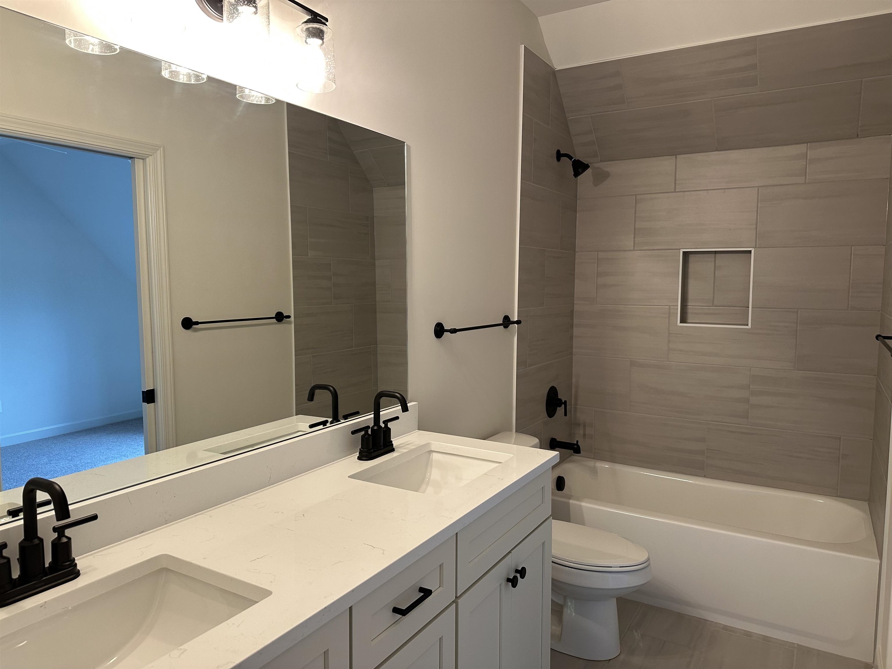 11504 Sunsparkler Way Collierville, TN 38017 - Photo 9 of 13 a bathroom with a sink a toilet a mirror and shower