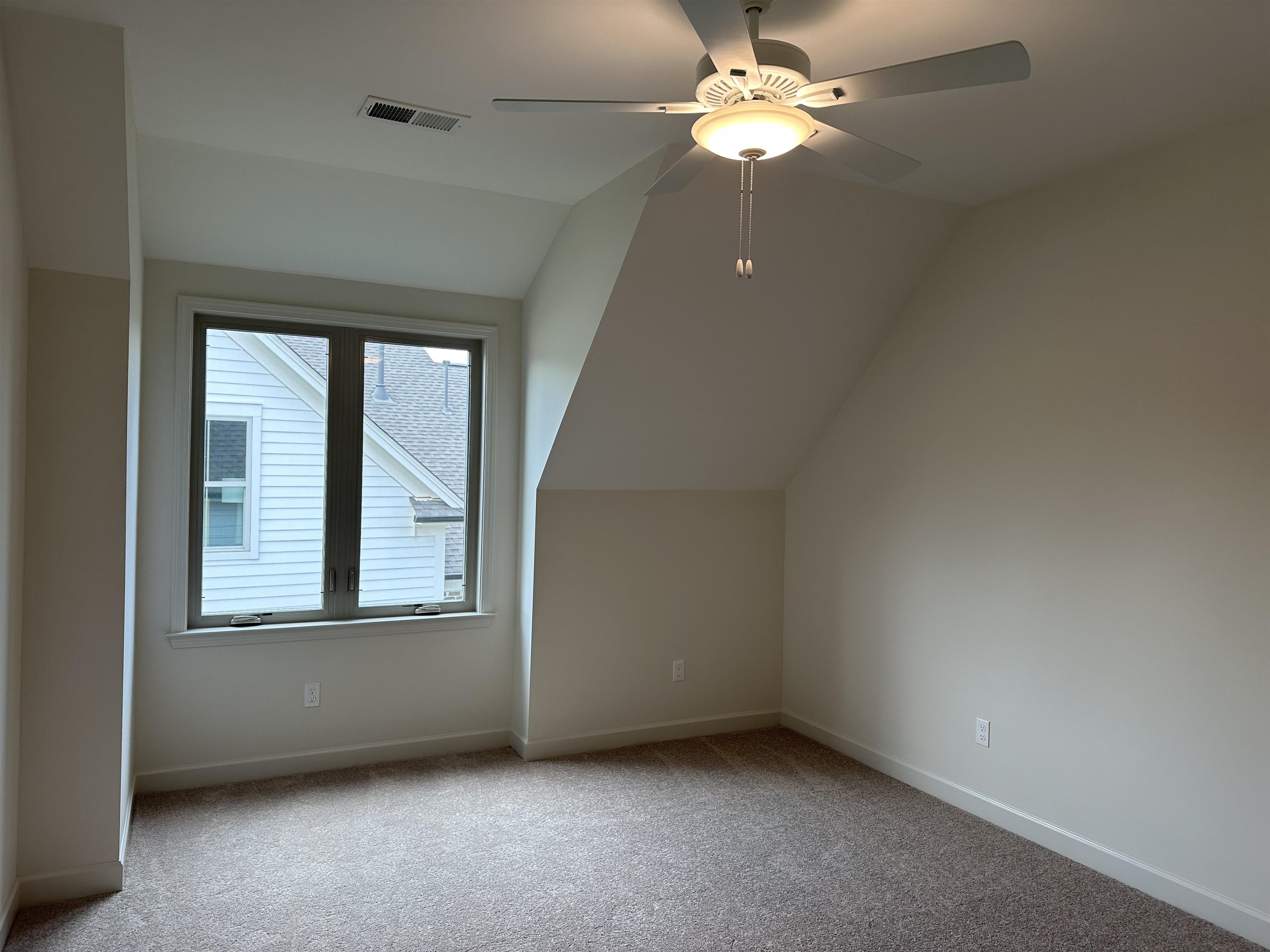 11504 Sunsparkler Way Collierville, TN 38017 - Photo 10 of 13 an empty room with a window and a fan