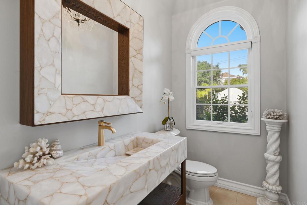 4248 Citrus Drive Fallbrook, CA 92028 - Photo 42 of 71 a bathroom with a granite countertop sink mirror and toilet