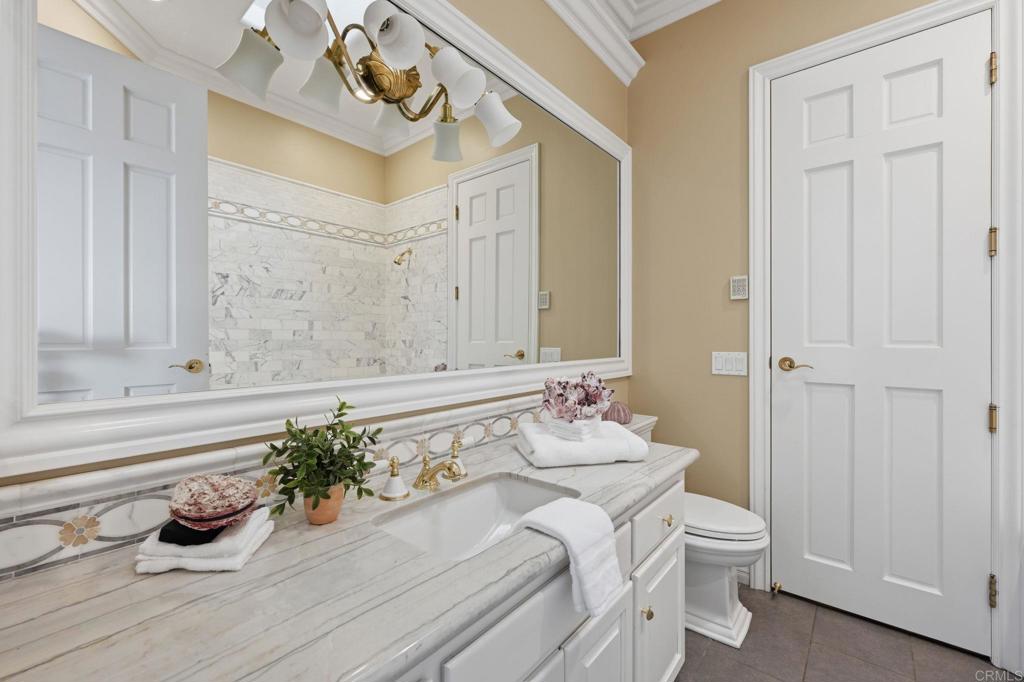 4248 Citrus Drive Fallbrook, CA 92028 - Photo 43 of 71 a bathroom with a sink a vanity and a mirror
