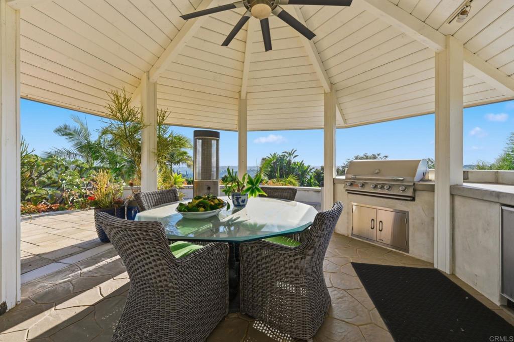 4248 Citrus Drive Fallbrook, CA 92028 - Photo 51 of 71 a view of a patio with table and chairs and potted plants