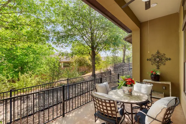 a view of a patio with a table and chairs