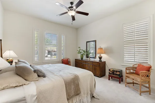a bedroom with a bed and furniture