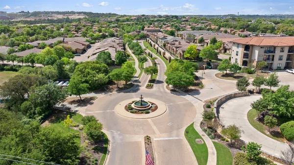 an aerial view of a residential houses and outdoor space