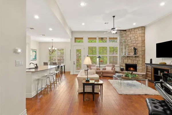 a living room with fireplace furniture and a flat screen tv