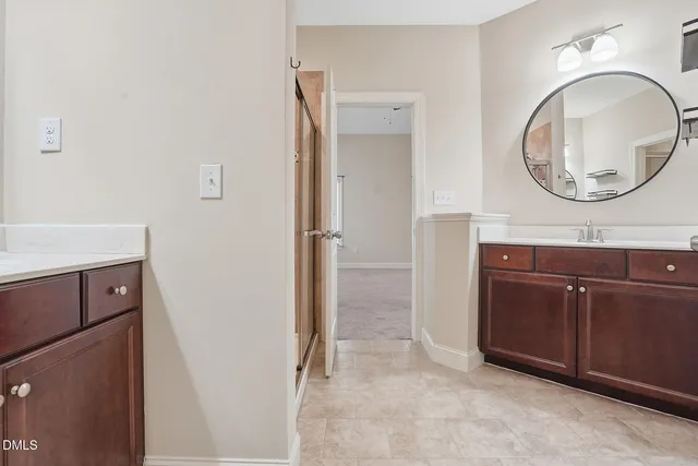 a bathroom with a sink a vanity and a mirror