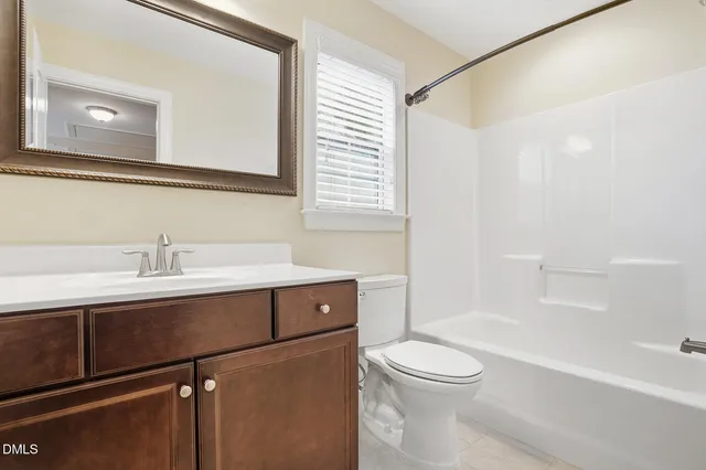 a bathroom with a sink a toilet and a bathtub