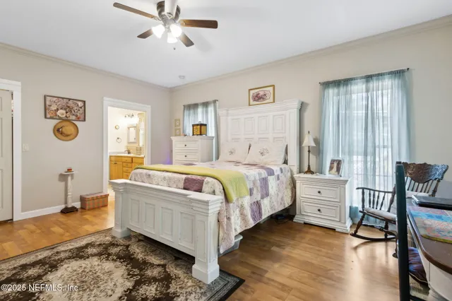 a bed room with a bed and a chair