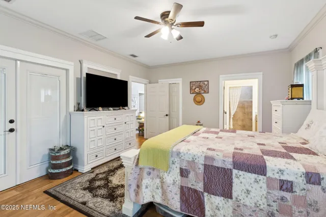a bedroom with bed and a book shelf