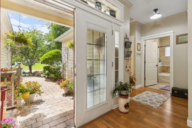 a view of livingroom with wooden floor and windows