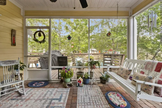 a view of a patio with table and chairs and potted plants