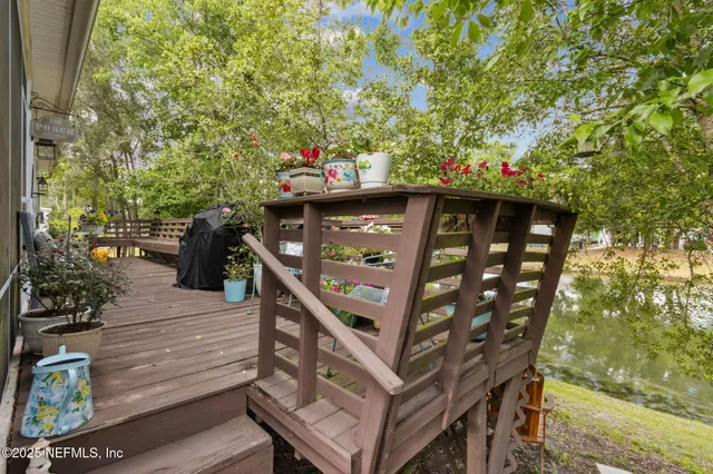 a front view of house with yard and trees around