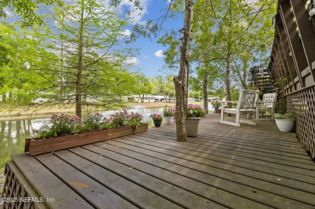 a view of a house with a yard and garden