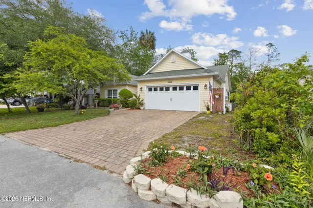a view of a balcony with wooden floor and fence