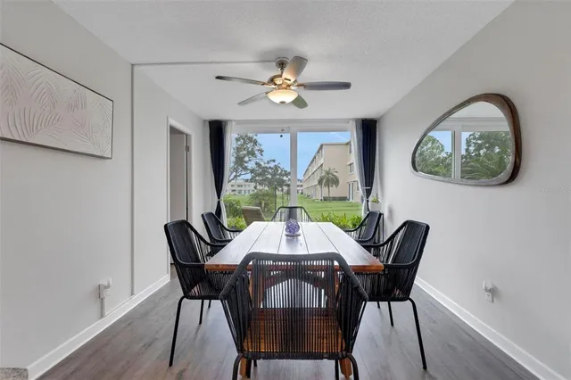 a view of a dining room with furniture window and outside view