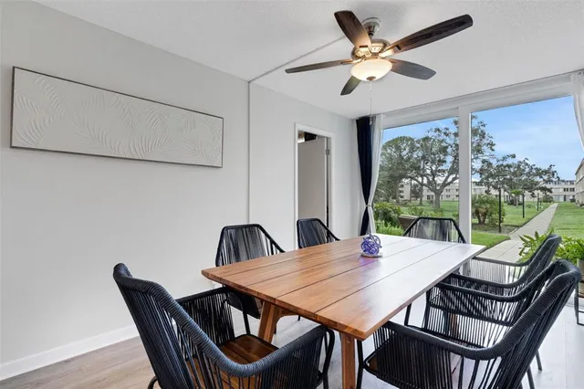 a view of a dining room with furniture and wooden floor