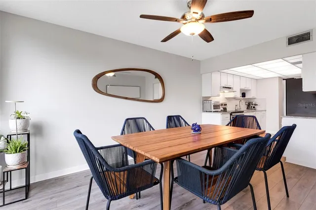 a kitchen with stainless steel appliances granite countertop a stove a sink dishwasher and a refrigerator