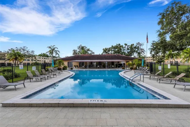 a view of a swimming pool with a patio