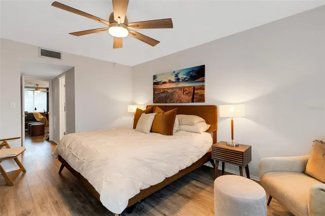 a bedroom with a bed and a couch