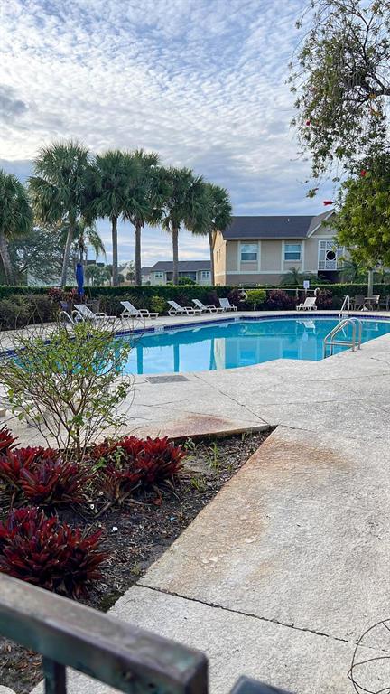 9817 Turf Way, Unit GE Orlando, FL 32837 - Photo 19 of 19 a front view of a house with a yard
