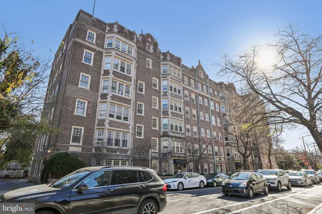 a view of a parked cars in front of a building