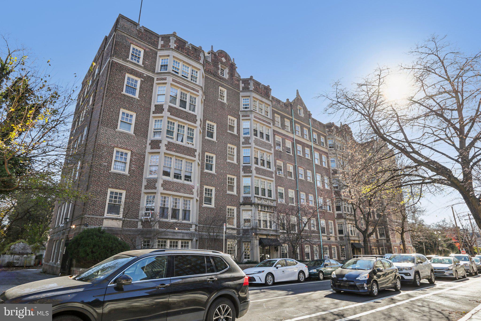 a view of a parked cars in front of a building