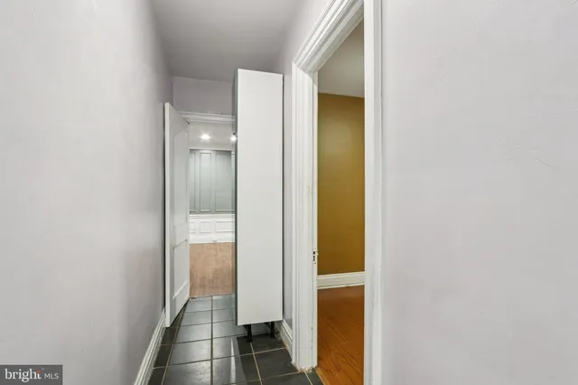 a view of a bathroom from a hallway