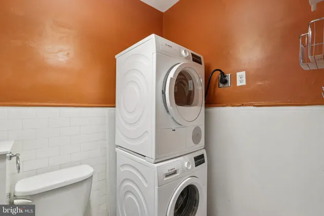a utility room with dryer and washer