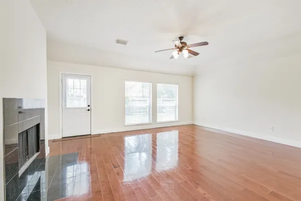 a view of an empty room with a window