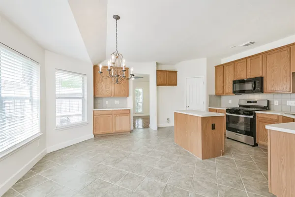 a view of a livingroom with a ceiling fan and window