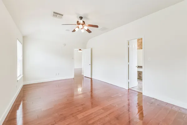 a kitchen with a sink a stove a refrigerator and cabinets