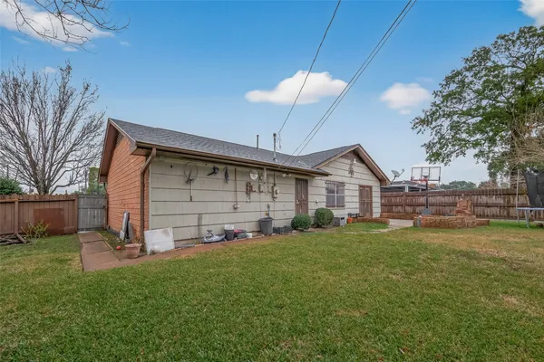 a view of a house with a yard and sitting area
