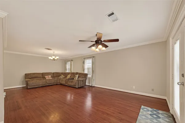 a view of a livingroom with furniture and wooden floor