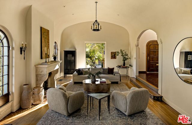 a living room with couch and a large window