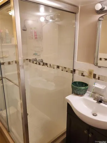 a bathroom with a sink and mirror