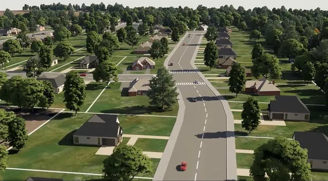an aerial view of residential houses with outdoor space and street view