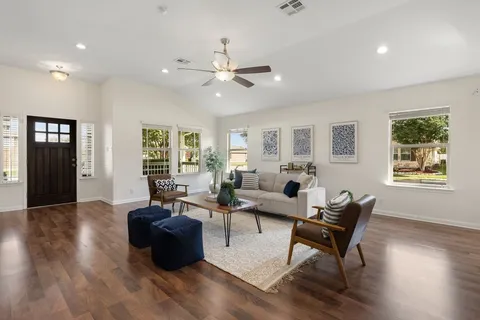 a kitchen with center island table and chairs in it