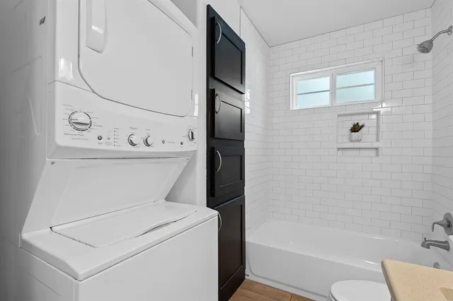 a bathroom with a bathtub sink and toilet