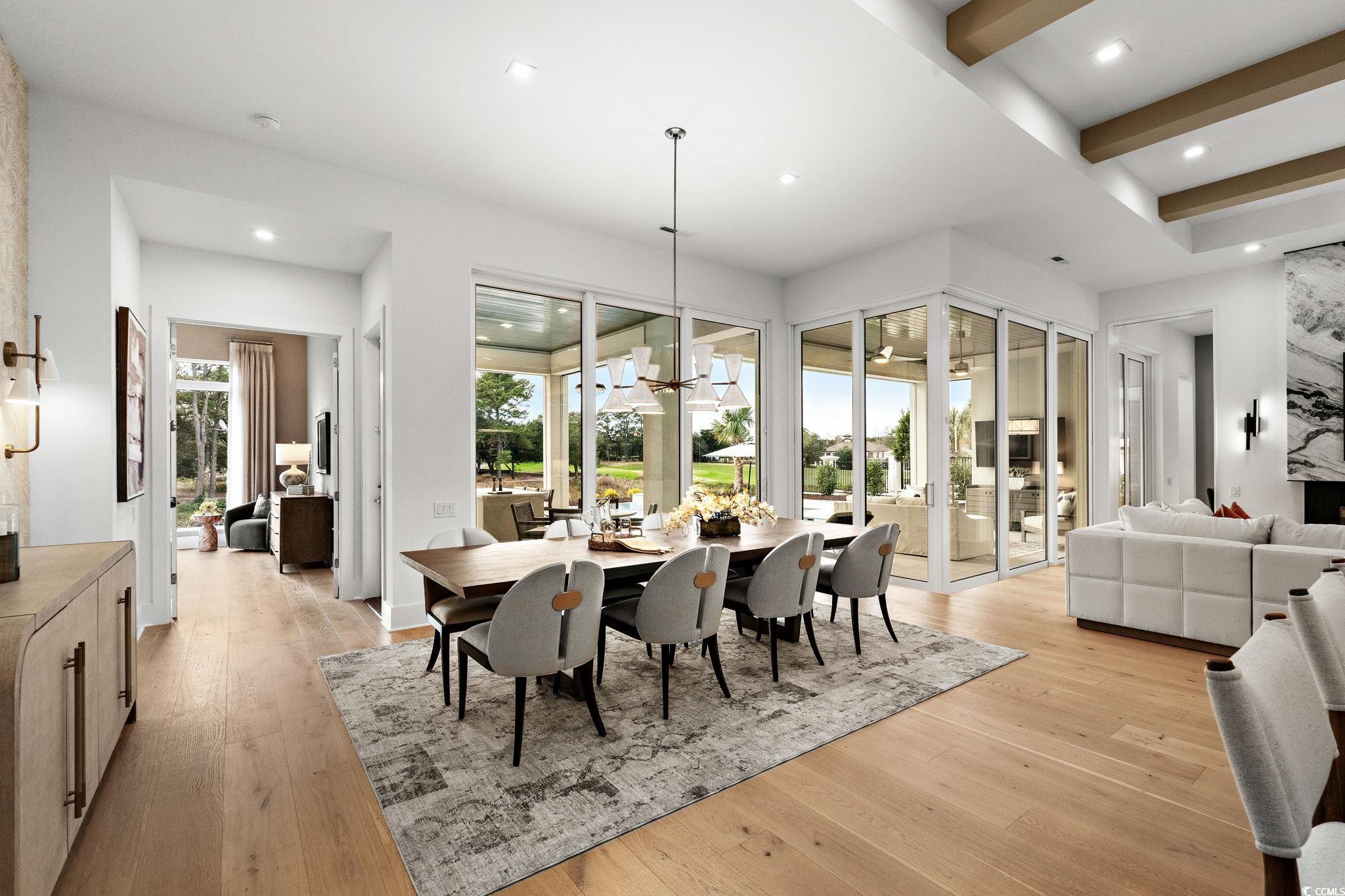 9273 Venezia Circle Myrtle Beach, SC 29579 - Photo 14 of 40 Dining room with a chandelier, light wood-style flooring, recessed lighting, and french doors