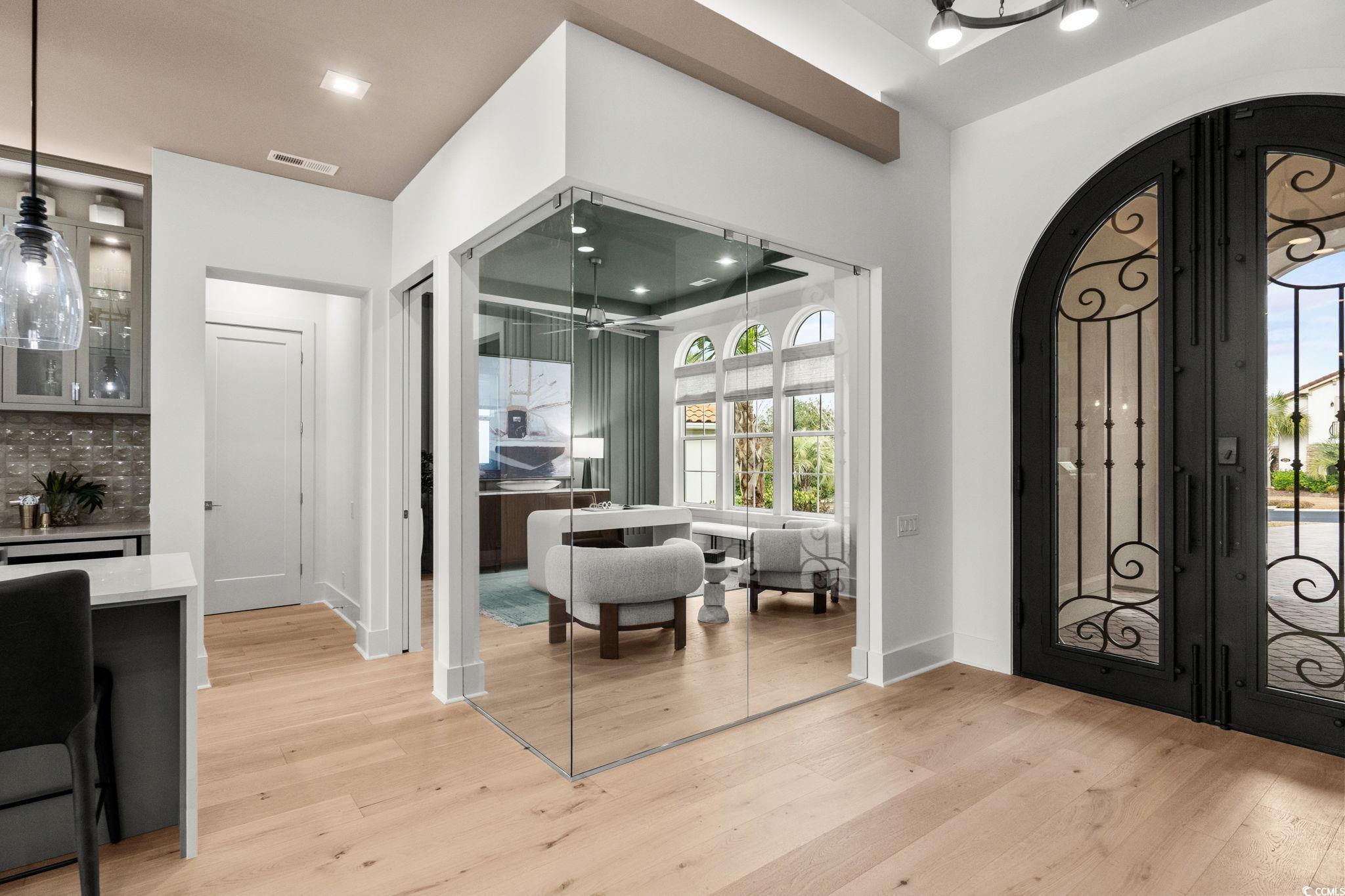 9273 Venezia Circle Myrtle Beach, SC 29579 - Photo 19 of 40 Foyer featuring arched walkways, light wood finished floors, a ceiling fan, and french doors