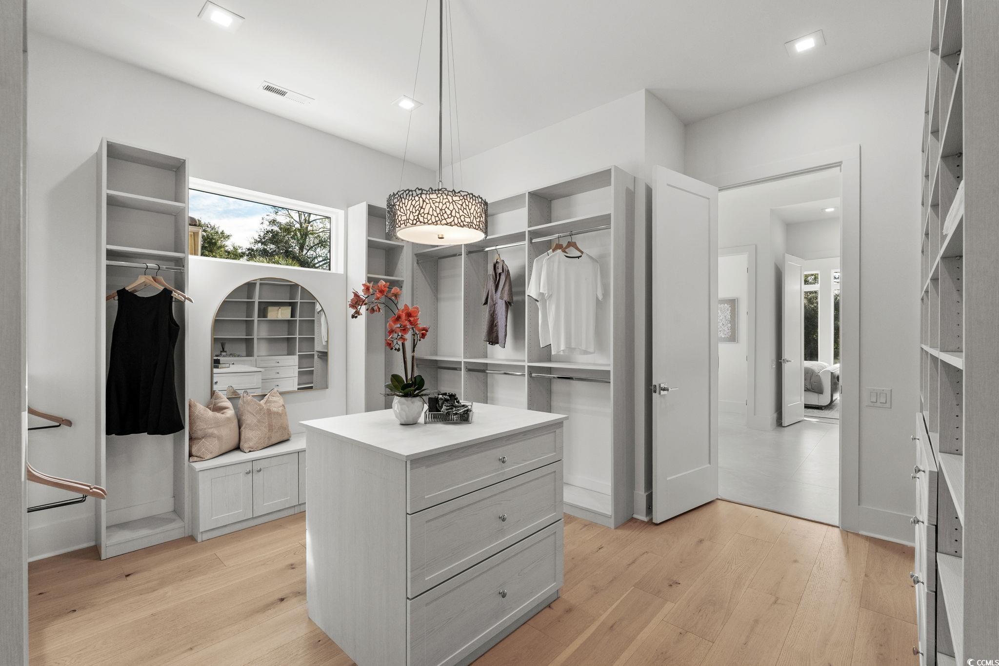 9273 Venezia Circle Myrtle Beach, SC 29579 - Photo 26 of 40 Walk in closet featuring light wood-type flooring