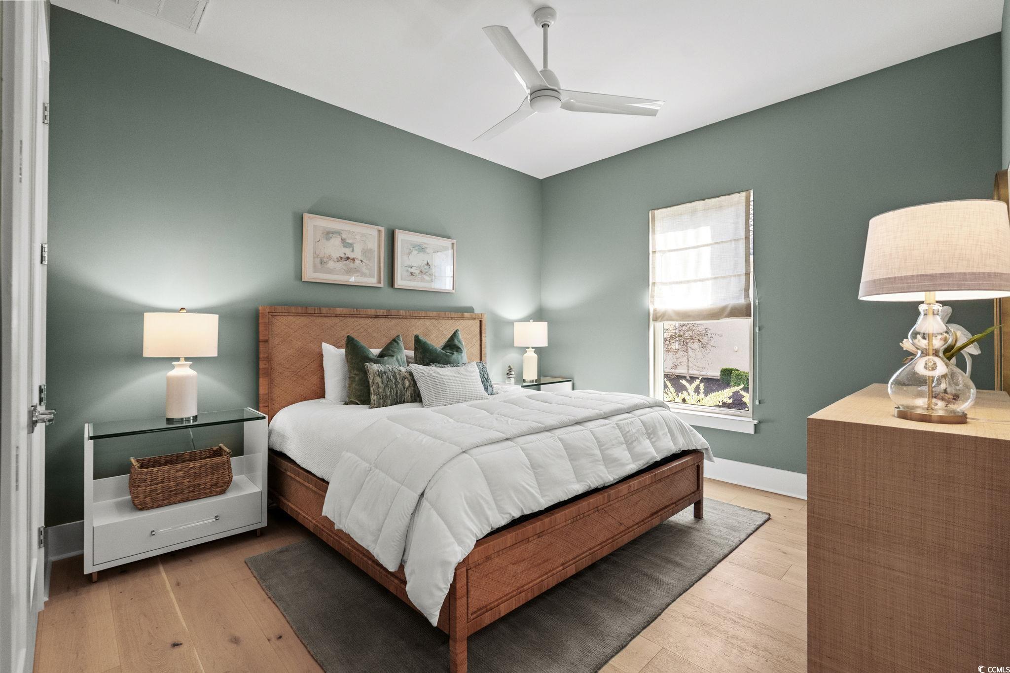 9273 Venezia Circle Myrtle Beach, SC 29579 - Photo 29 of 40 Bedroom with light wood-style flooring and ceiling fan