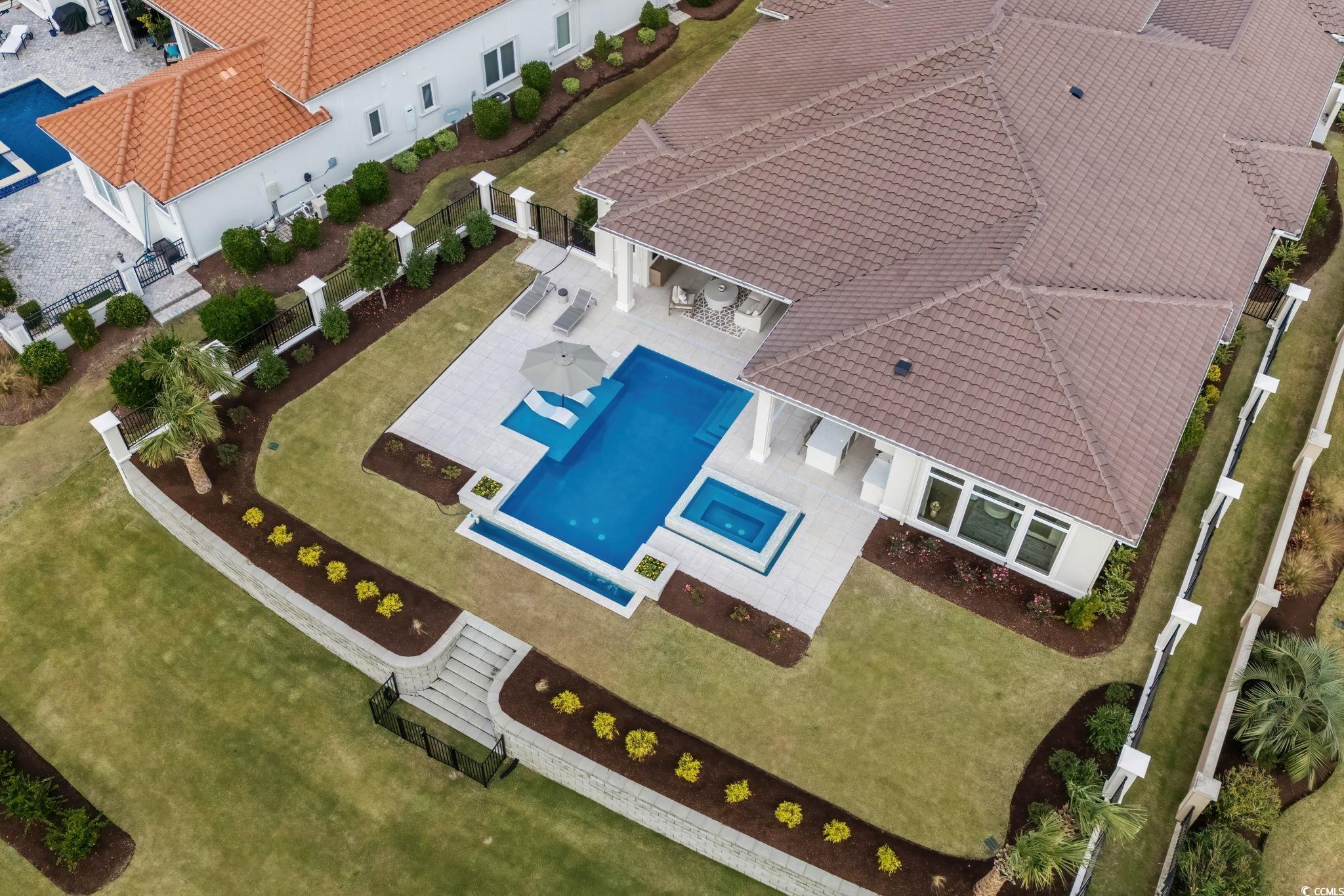9273 Venezia Circle Myrtle Beach, SC 29579 - Photo 4 of 40 Aerial view of property and surrounding area featuring a pool