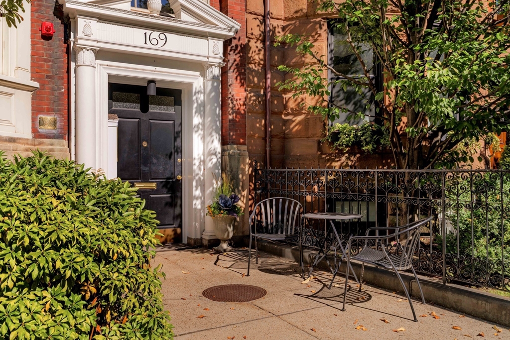 a view of a chair and table in the balcony