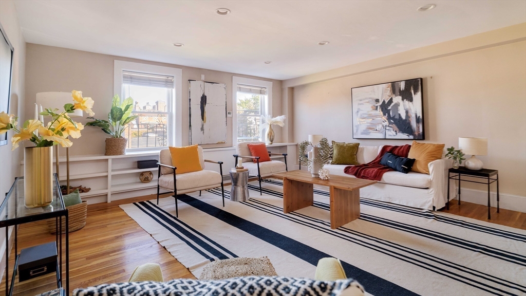169 Commonwealth Avenue, Unit 5 Boston, MA 02116 - Photo 16 of 31 a living room with furniture and a potted plant
