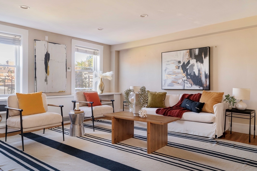 169 Commonwealth Avenue, Unit 5 Boston, MA 02116 - Photo 17 of 31 a living room with furniture and a large window