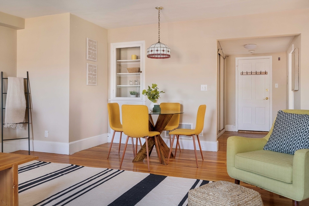 169 Commonwealth Avenue, Unit 5 Boston, MA 02116 - Photo 18 of 31 a living room with furniture and wooden floor