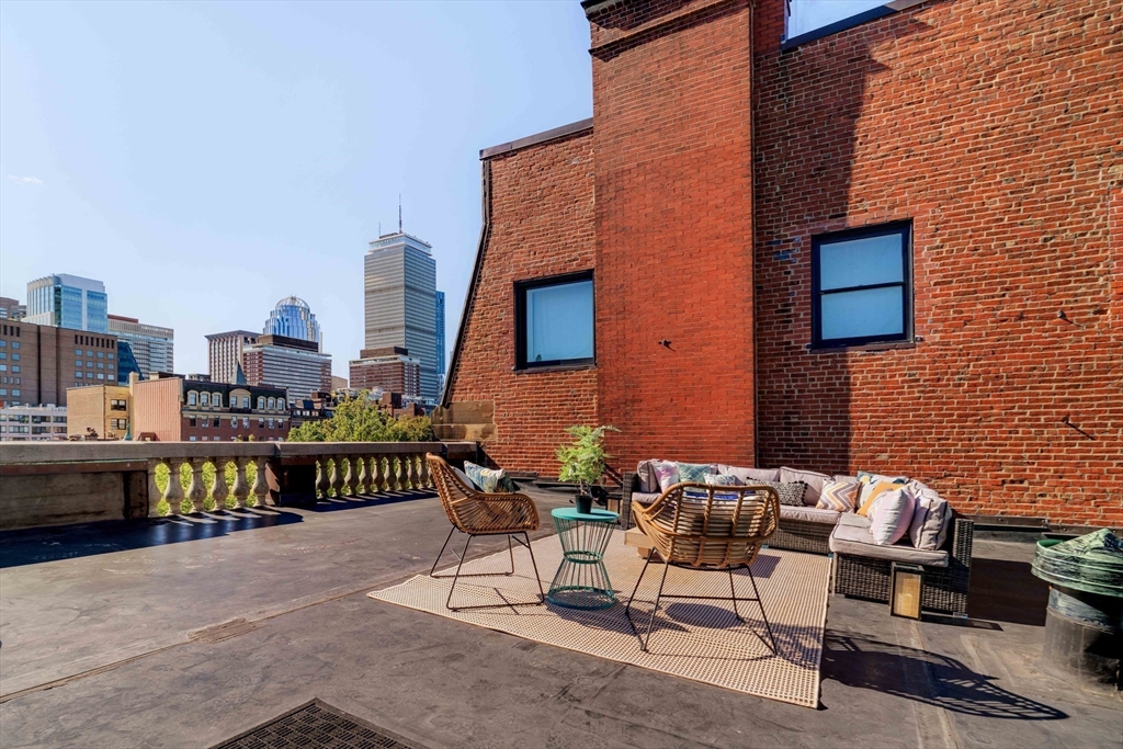 169 Commonwealth Avenue, Unit 5 Boston, MA 02116 - Photo 24 of 31 a couple of chairs sitting in front of building